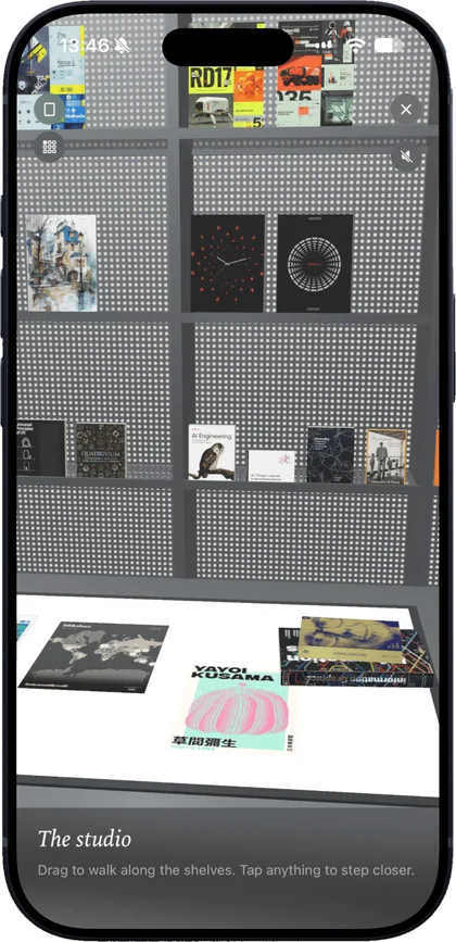 Posters on a studio shelf above a lit light table